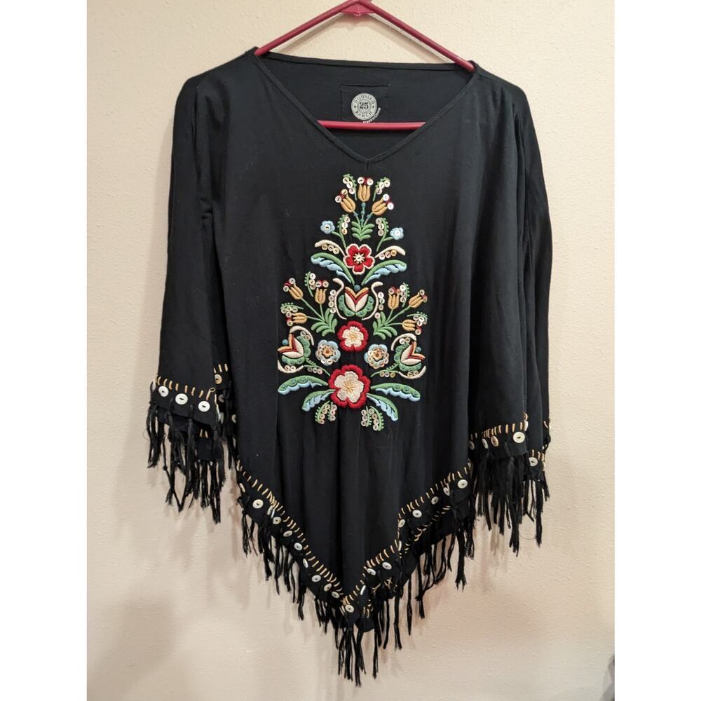 Black embroidered floral poncho w/ mother of pearl buttons & tassel detailing